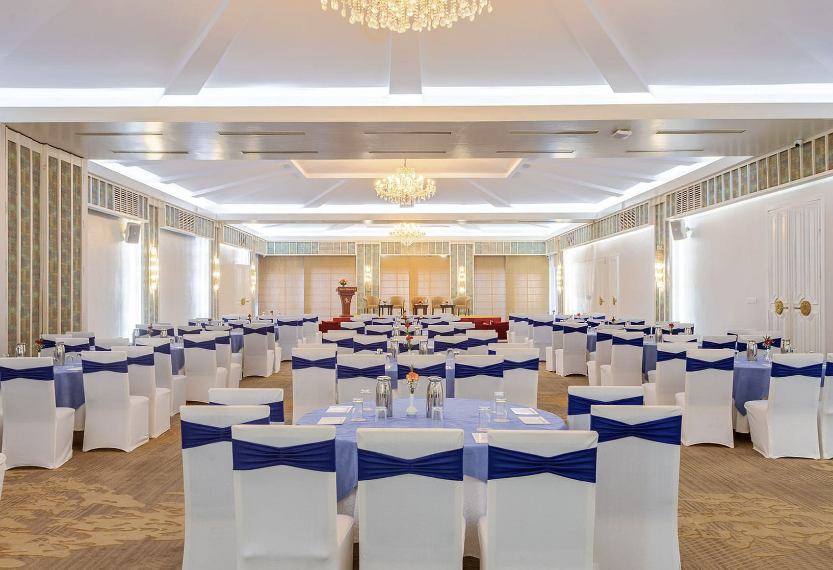Grand ballroom arranged for a formal event